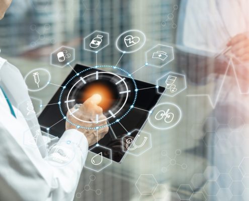 Doctor using a MedTech device.